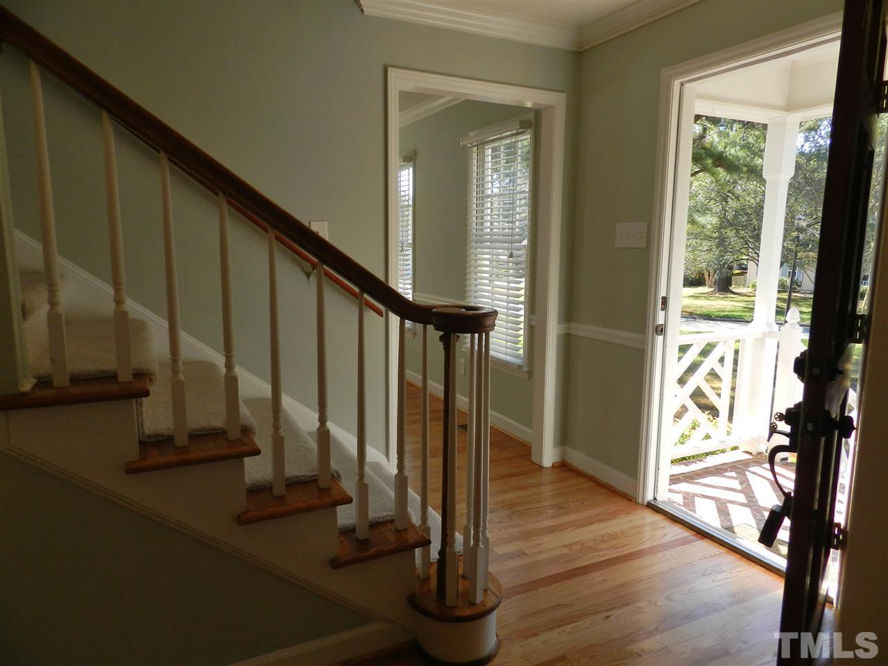 103 Rother Lane Durham, NC 27707 - Photo 4 of 24 a view of an entryway with wooden floor and door