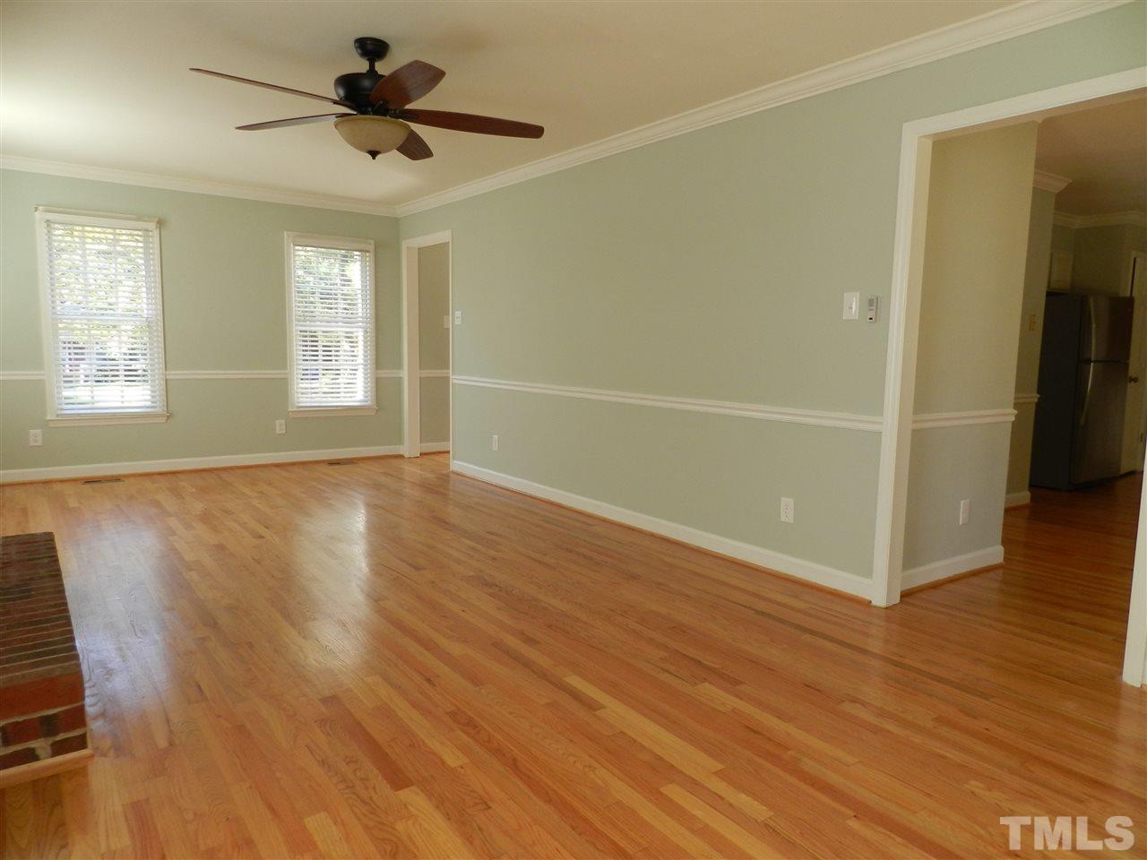 103 Rother Lane Durham, NC 27707 - Photo 6 of 24 a view of empty room with wooden floor and fan