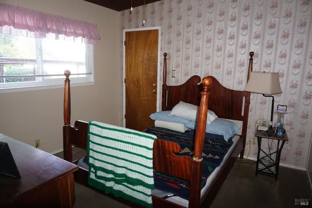 a view of workspace with furniture and window