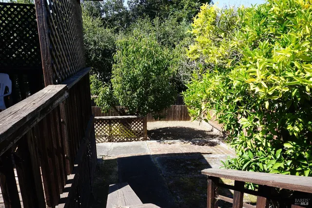 a view of a yard from a balcony