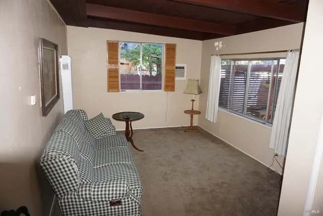 a view of a livingroom with windows