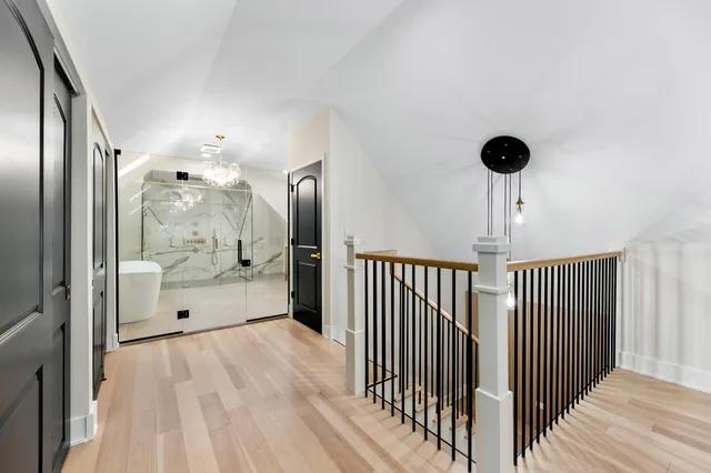 a view of a hallway with a bathroom