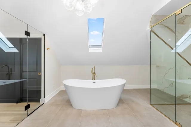 a white bath tub sitting next to a white sink