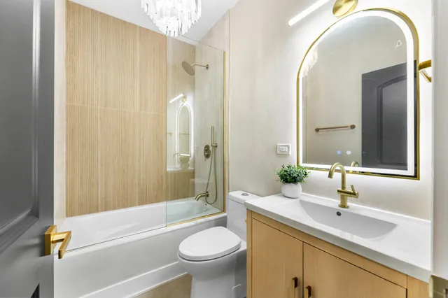 a bathroom with a sink a toilet and a bathtub