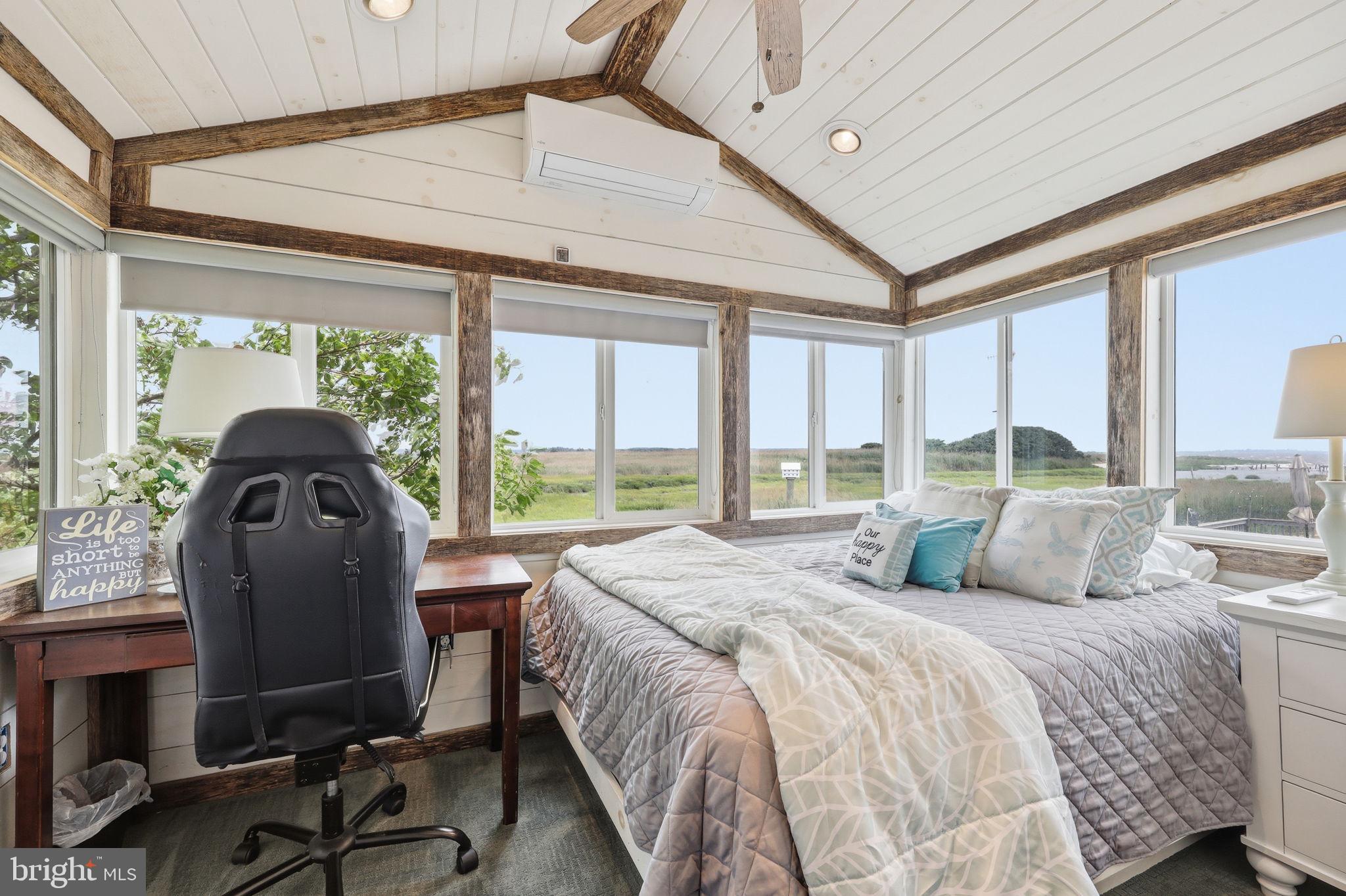 173 Cove Road Newport, NJ 08345 - Photo 27 of 72 a bedroom with a bed and large windows