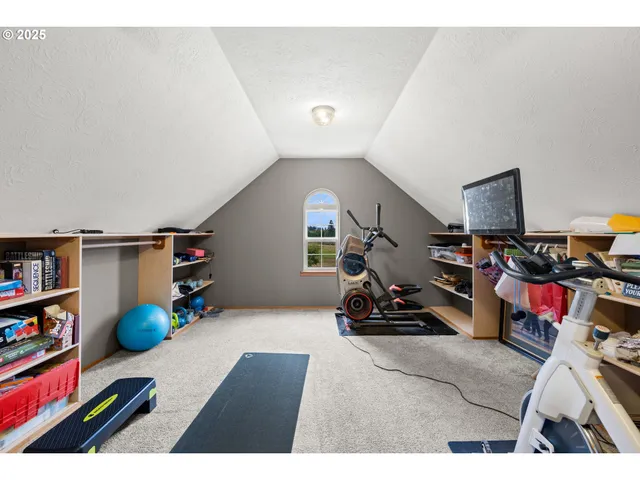a living room with lots of furniture and clutter