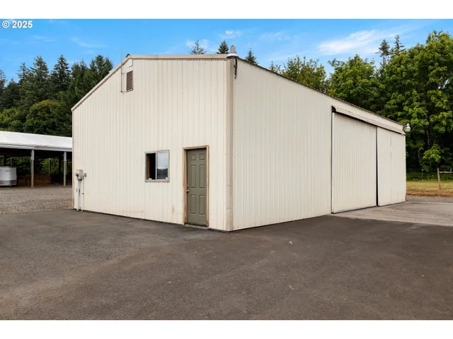 a view of a white house with outdoor space