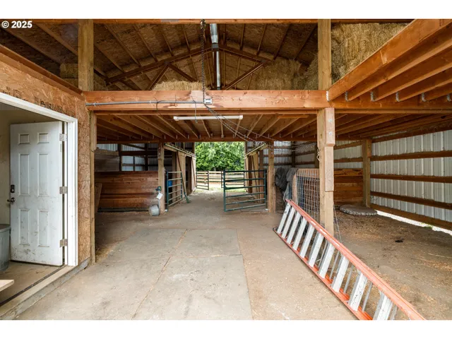 a view of a garage room with wooden floor