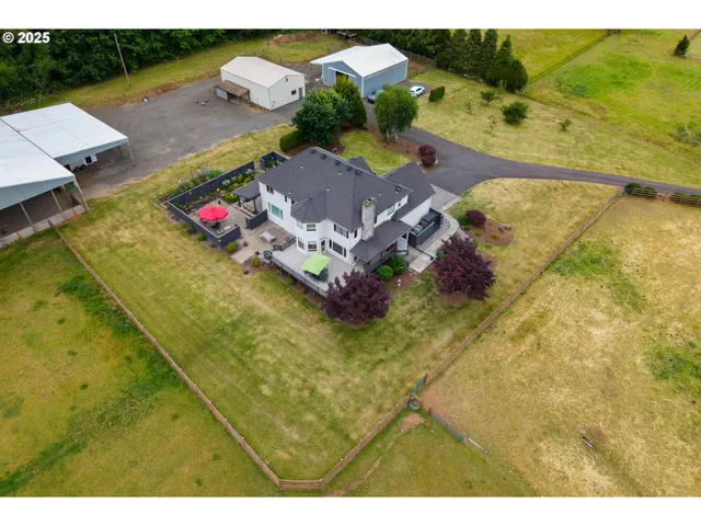 an aerial view of residential house with pool