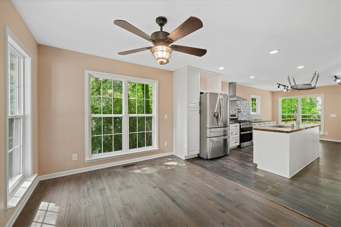 210 Briarcliff Road Central, SC 29630 - Photo 9 of 39 This open concept kitchen and dining area features abundant natural light and sleek appliances.