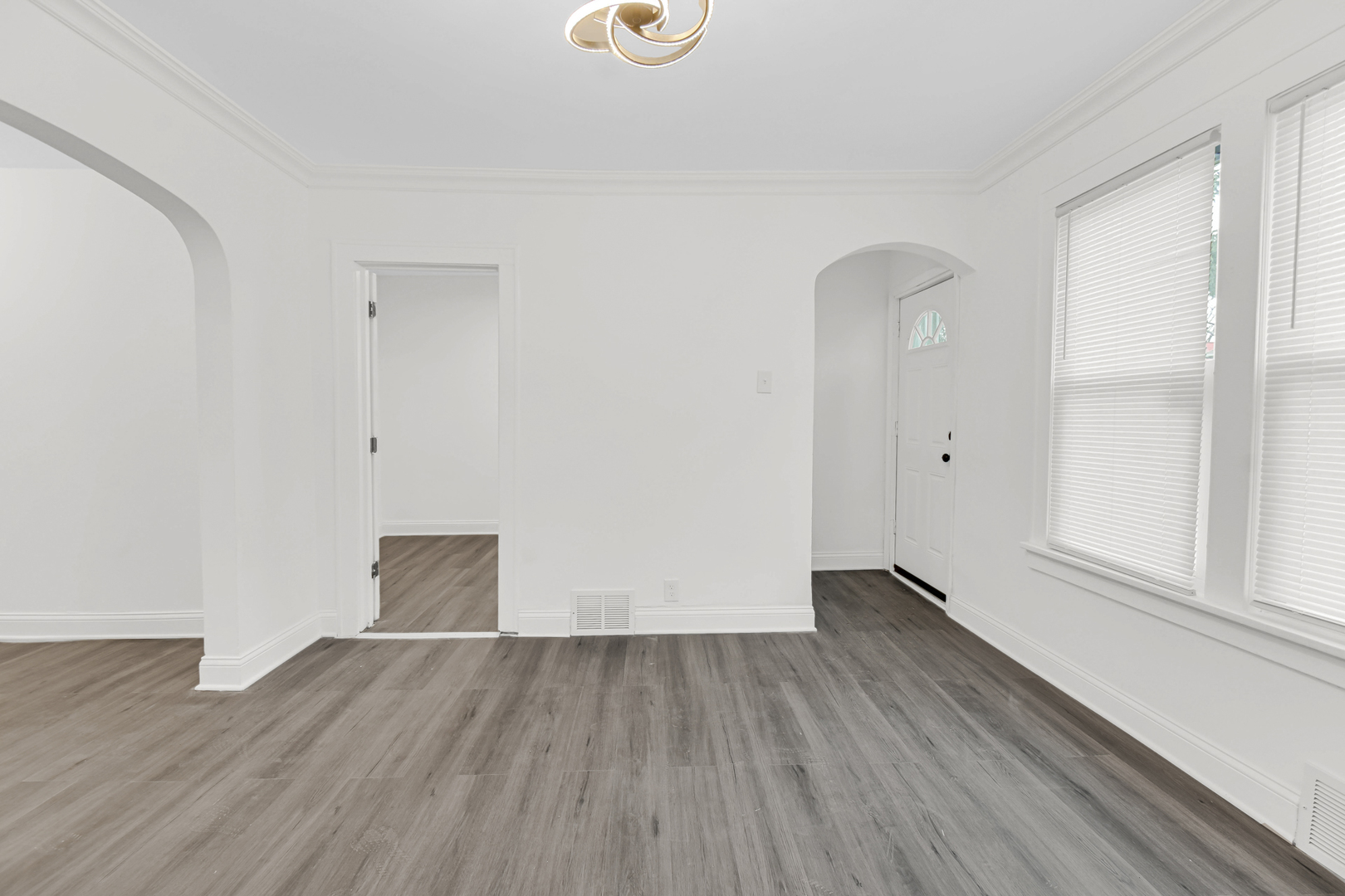1032 West 103rd Place Chicago, IL 60643 - Photo 5 of 19 a view of empty room with wooden floor and fan