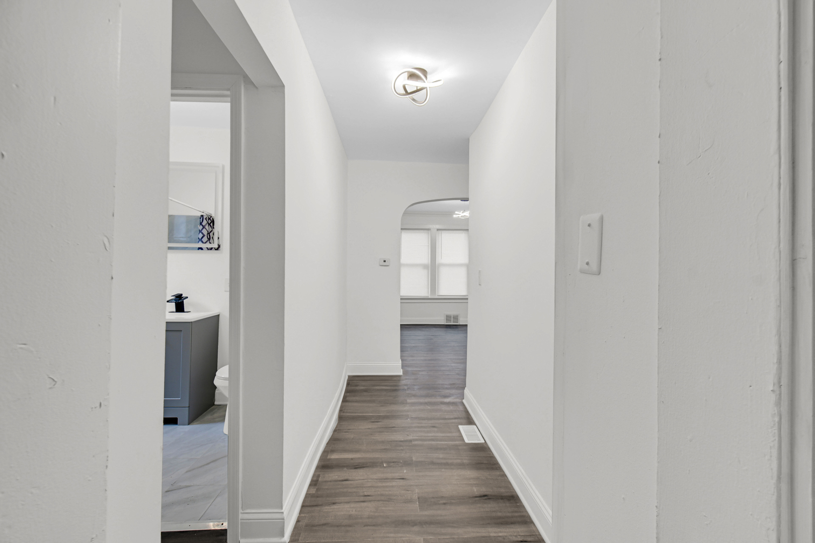 1032 West 103rd Place Chicago, IL 60643 - Photo 7 of 19 a view of a hallway with wooden floor and entryway
