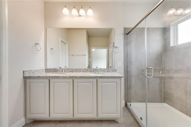 a bathroom with a granite countertop sink a toilet and bathtub