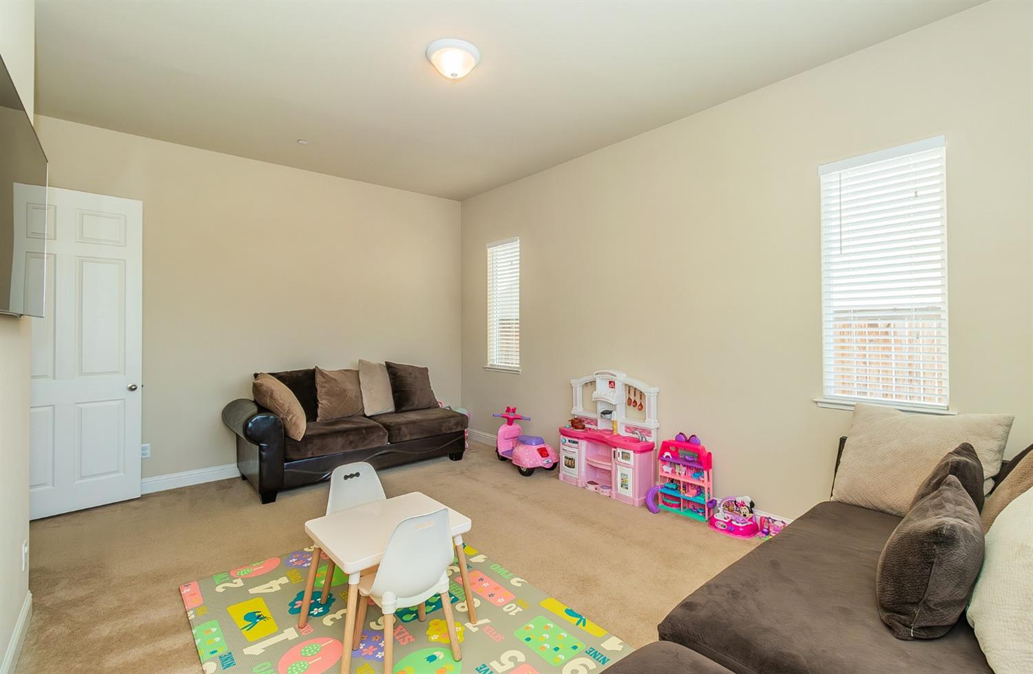 2610 Sample Avenue Clovis, CA 93611 - Photo 13 of 36 a bedroom with a bed and furniture