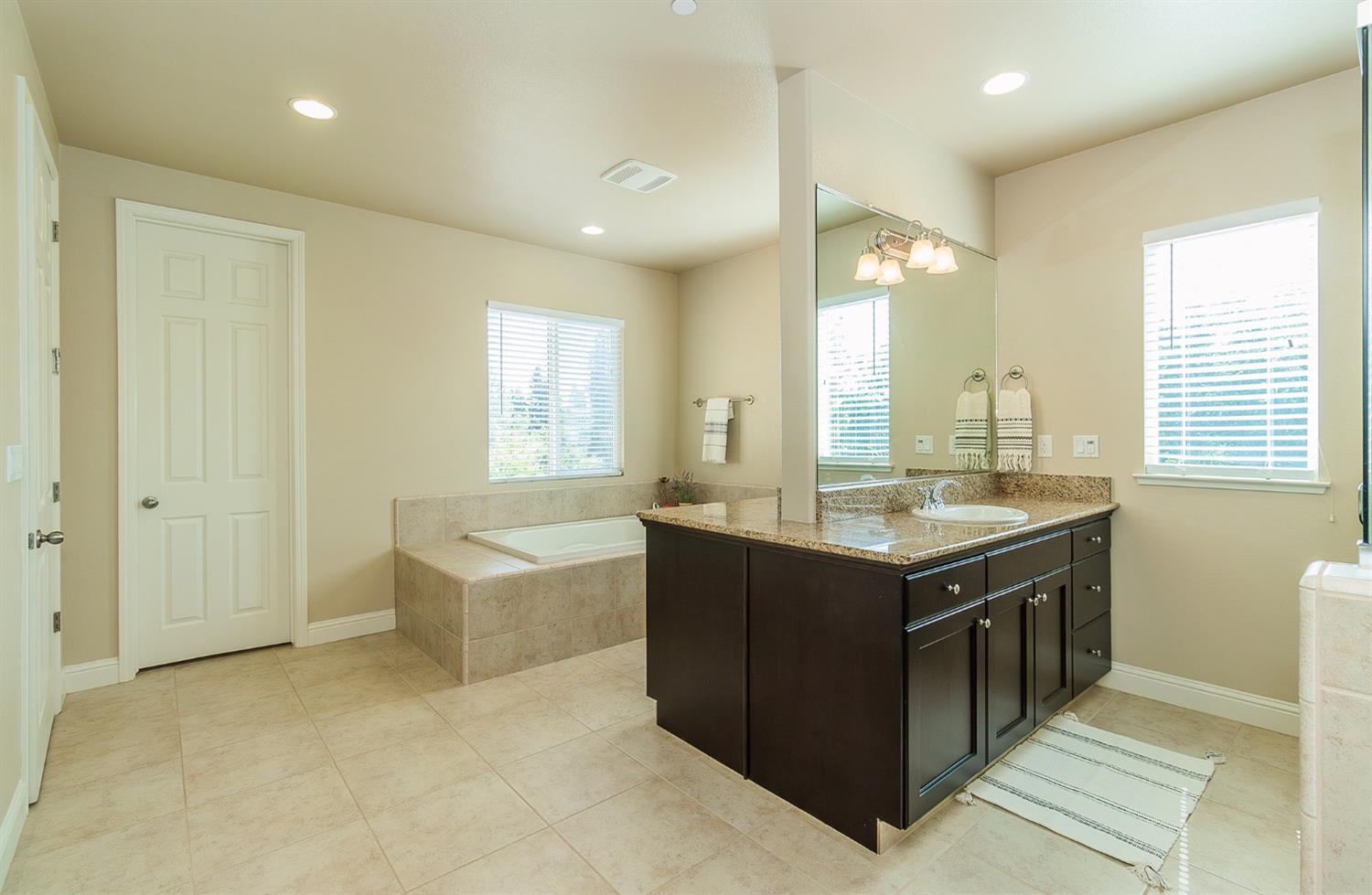 2610 Sample Avenue Clovis, CA 93611 - Photo 25 of 36 a kitchen with a stove and a sink