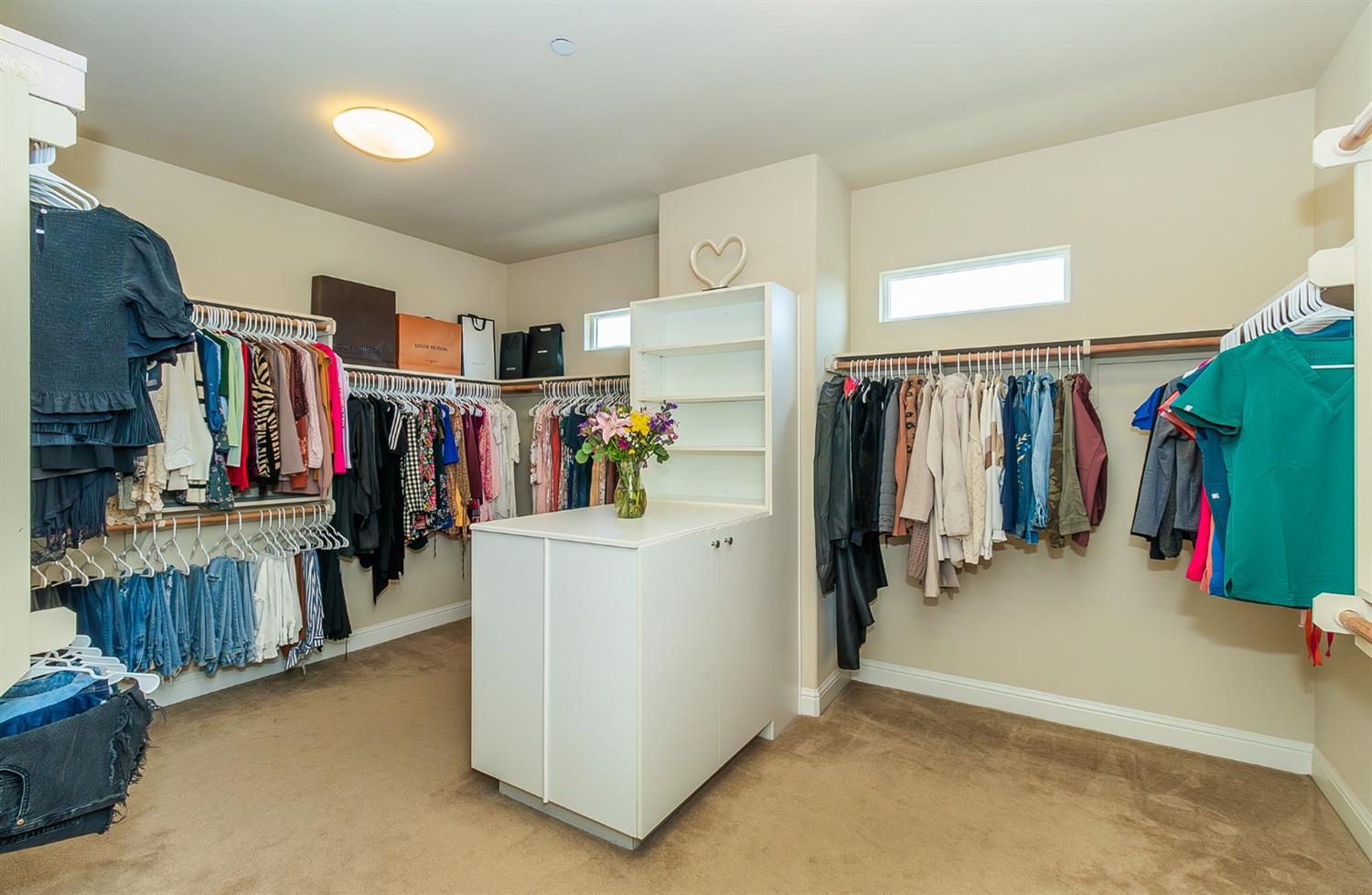 2610 Sample Avenue Clovis, CA 93611 - Photo 27 of 36 a view of walk in closet with clothes