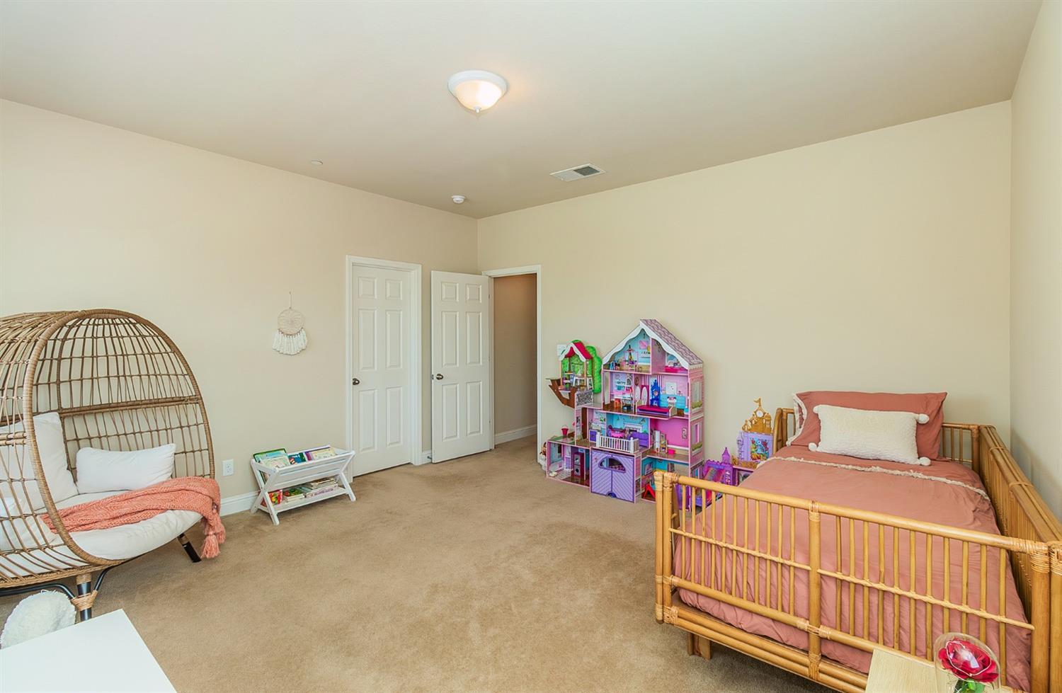 2610 Sample Avenue Clovis, CA 93611 - Photo 29 of 36 a bedroom with furniture and a gate