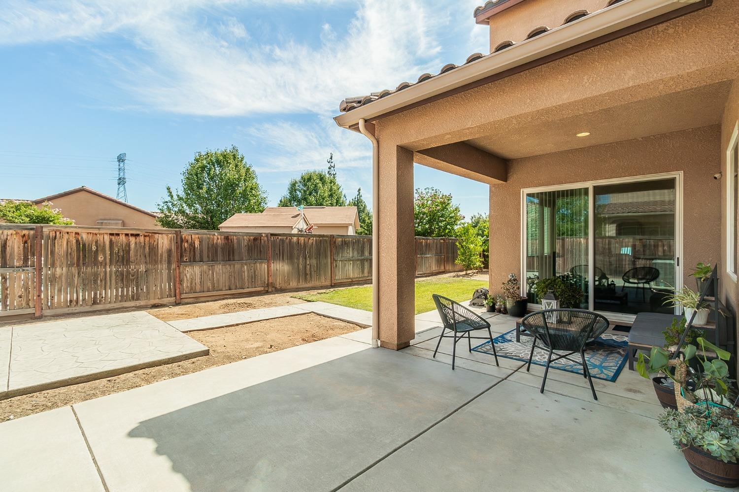 2610 Sample Avenue Clovis, CA 93611 - Photo 33 of 36 a patio with glass top table and chairs