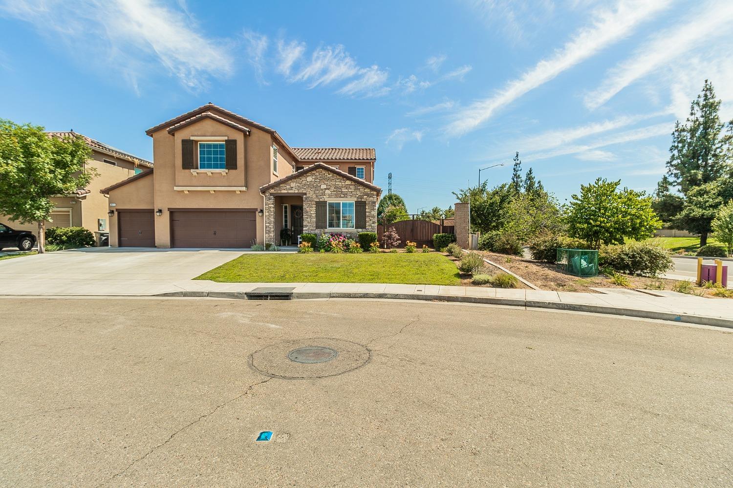 2610 Sample Avenue Clovis, CA 93611 - Photo 36 of 36 a view of a house with a swimming pool and a yard