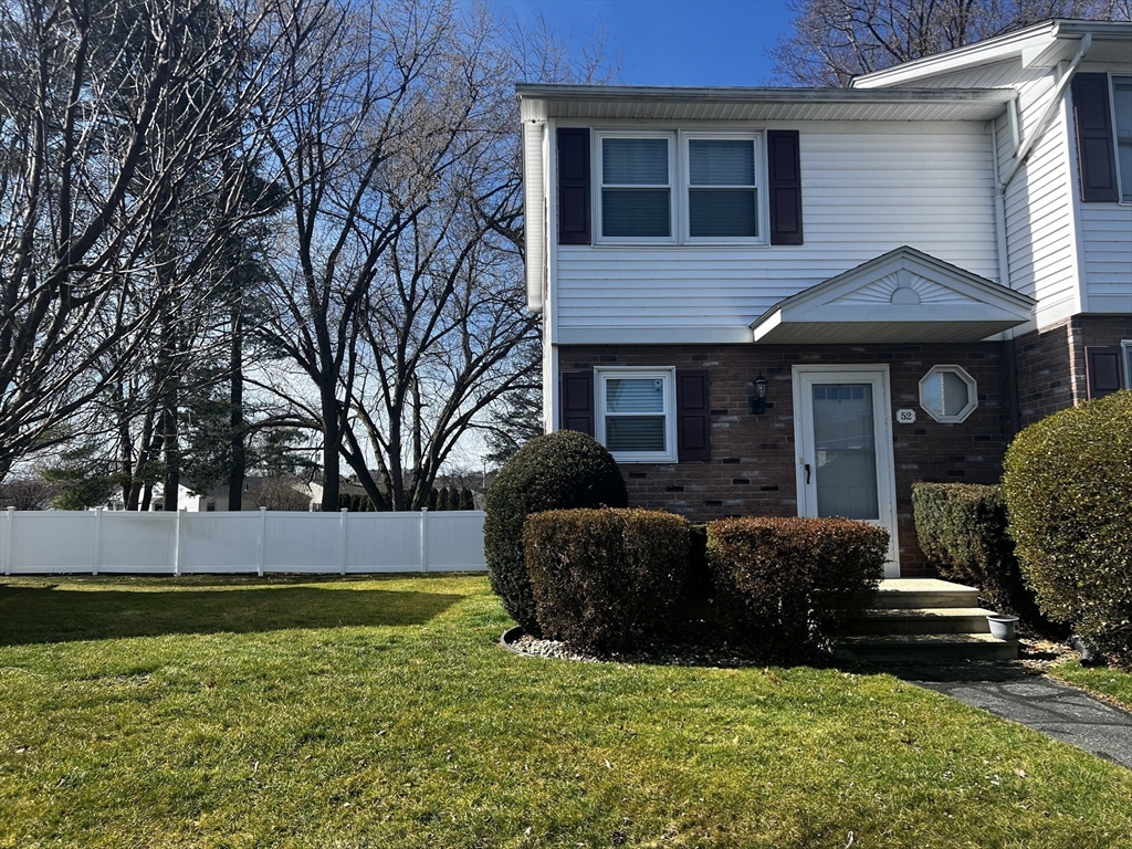 55 Empire Street, Unit 52 Chicopee, MA 01013 - Photo 1 of 18 a view of a house with backyard and sitting area