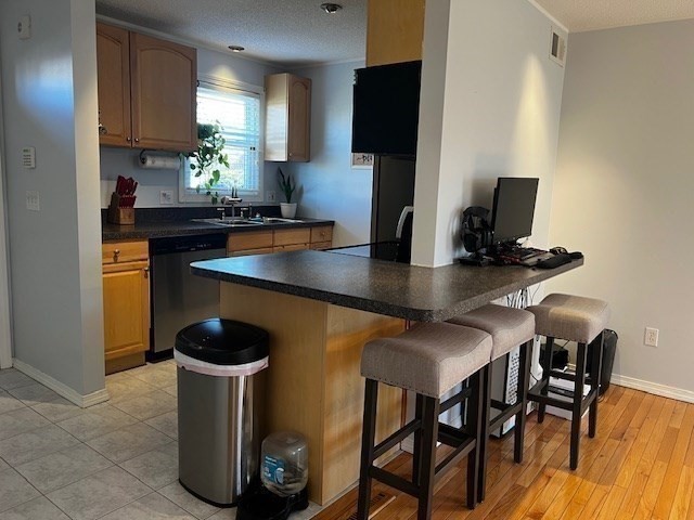 55 Empire Street, Unit 52 Chicopee, MA 01013 - Photo 11 of 18 a kitchen with dining table and chairs