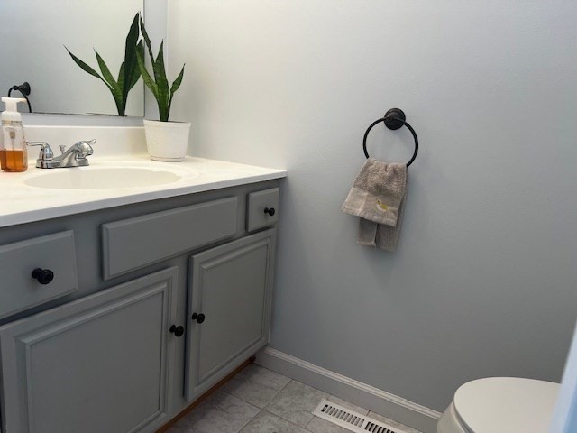 55 Empire Street, Unit 52 Chicopee, MA 01013 - Photo 15 of 18 a bathroom with a toilet sink and mirror