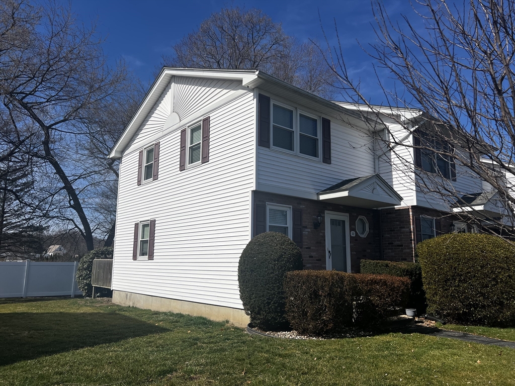 55 Empire Street, Unit 52 Chicopee, MA 01013 - Photo 18 of 18 a view of a house with backyard and sitting area