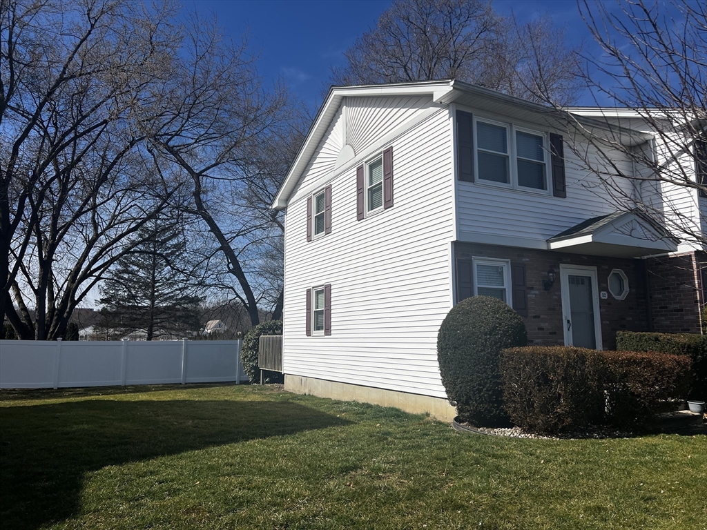 55 Empire Street, Unit 52 Chicopee, MA 01013 - Photo 2 of 18 a view of a house with a yard