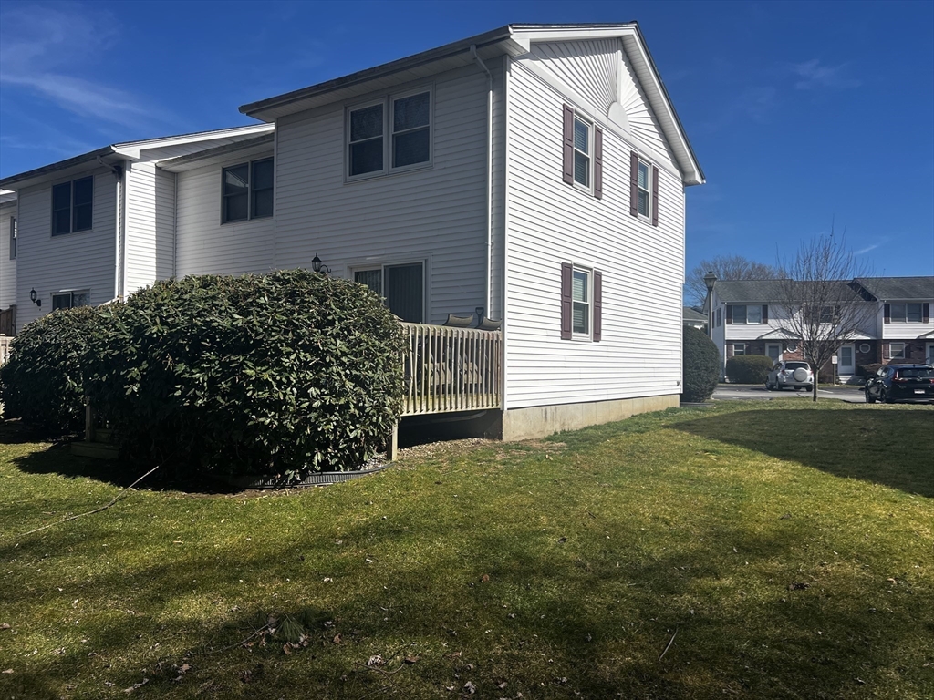 55 Empire Street, Unit 52 Chicopee, MA 01013 - Photo 4 of 18 a front view of a house with garden