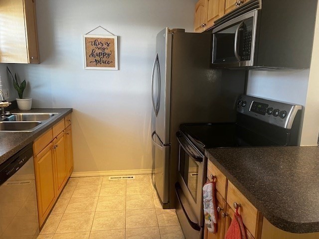55 Empire Street, Unit 52 Chicopee, MA 01013 - Photo 8 of 18 a kitchen with a refrigerator and a stove