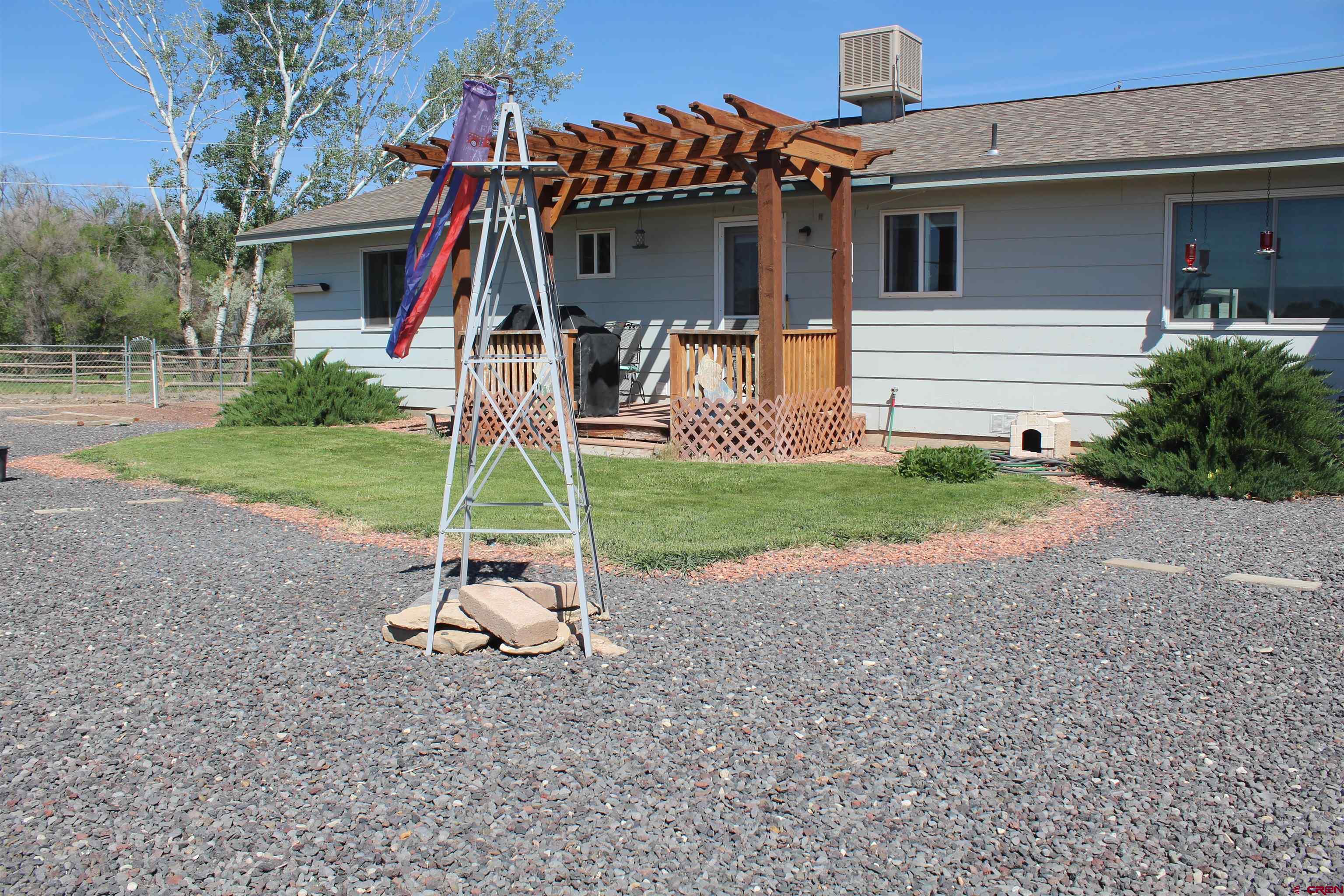 13762 F Road Delta, CO 81416 - Photo 21 of 34 a view of a house with a yard