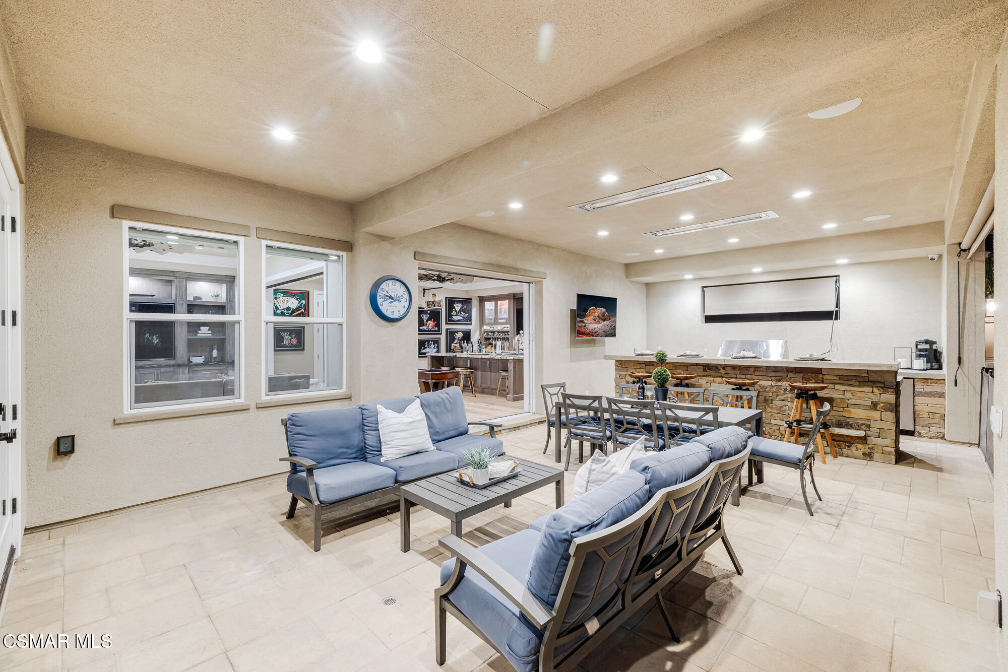 6508 High Country Place Moorpark, CA 93021 - Photo 47 of 95 a living room with furniture a table and kitchen view