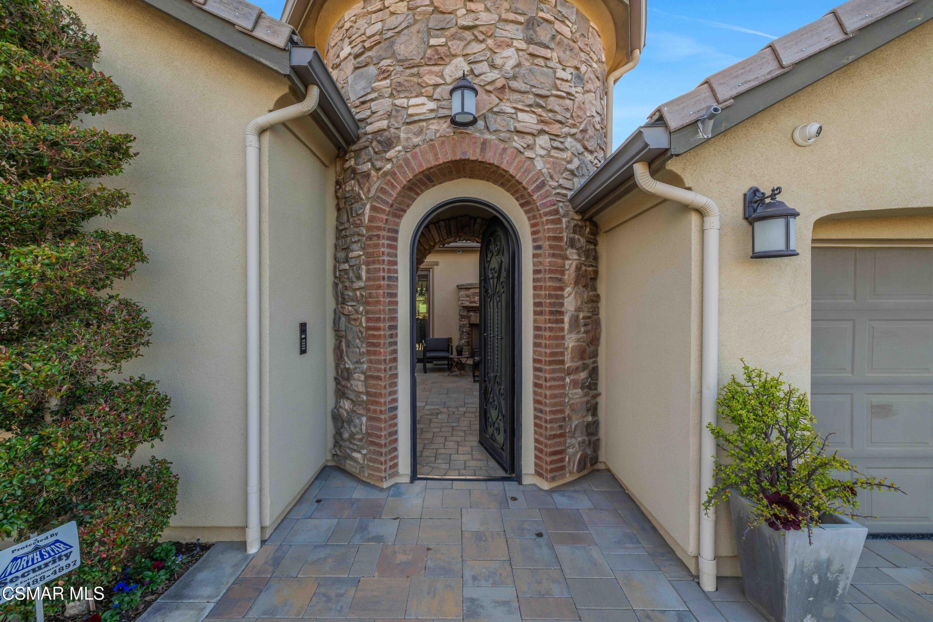 6508 High Country Place Moorpark, CA 93021 - Photo 5 of 95 a view of a door of the house with potted plants
