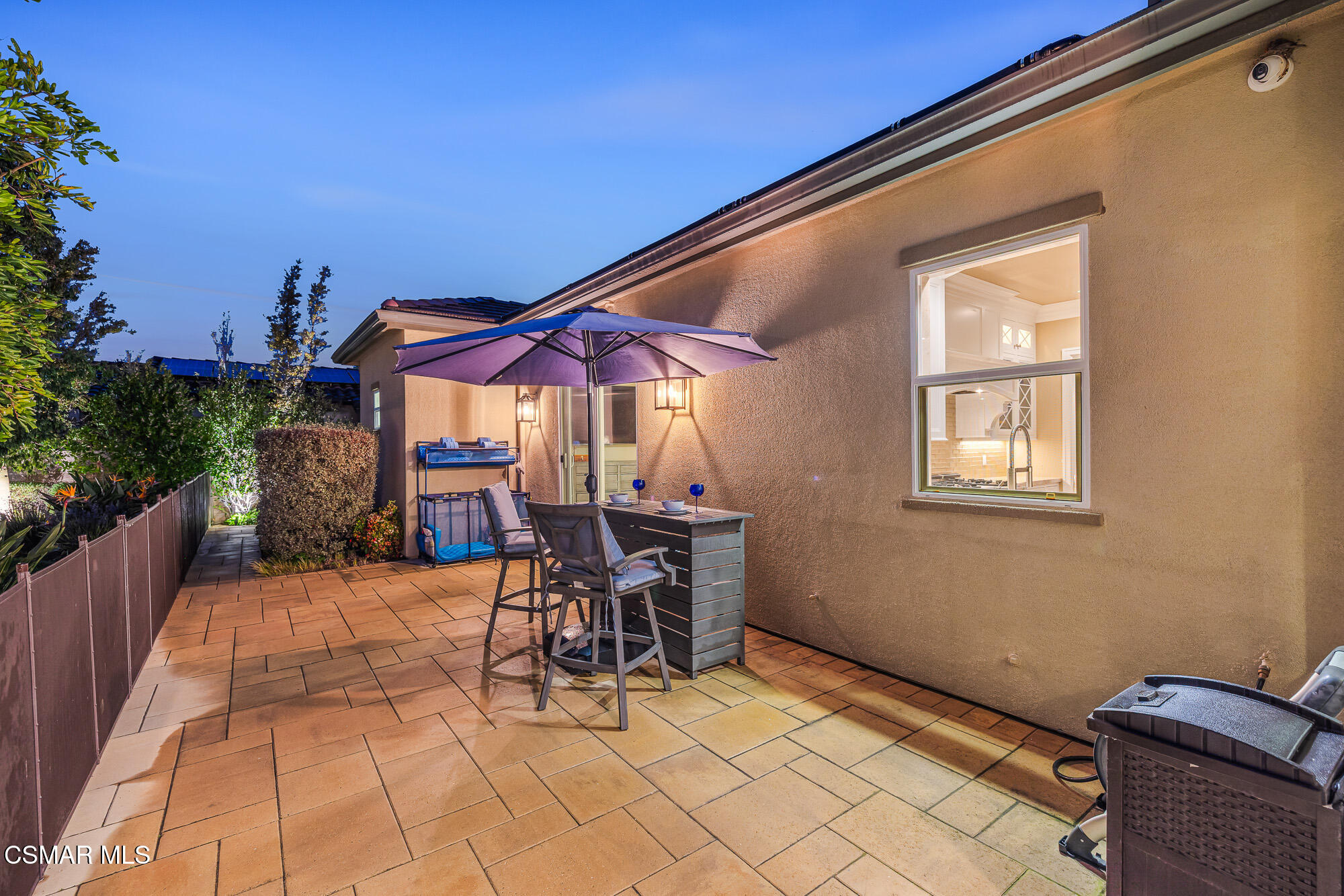 6508 High Country Place Moorpark, CA 93021 - Photo 52 of 95 a patio with a table and chairs and potted plants