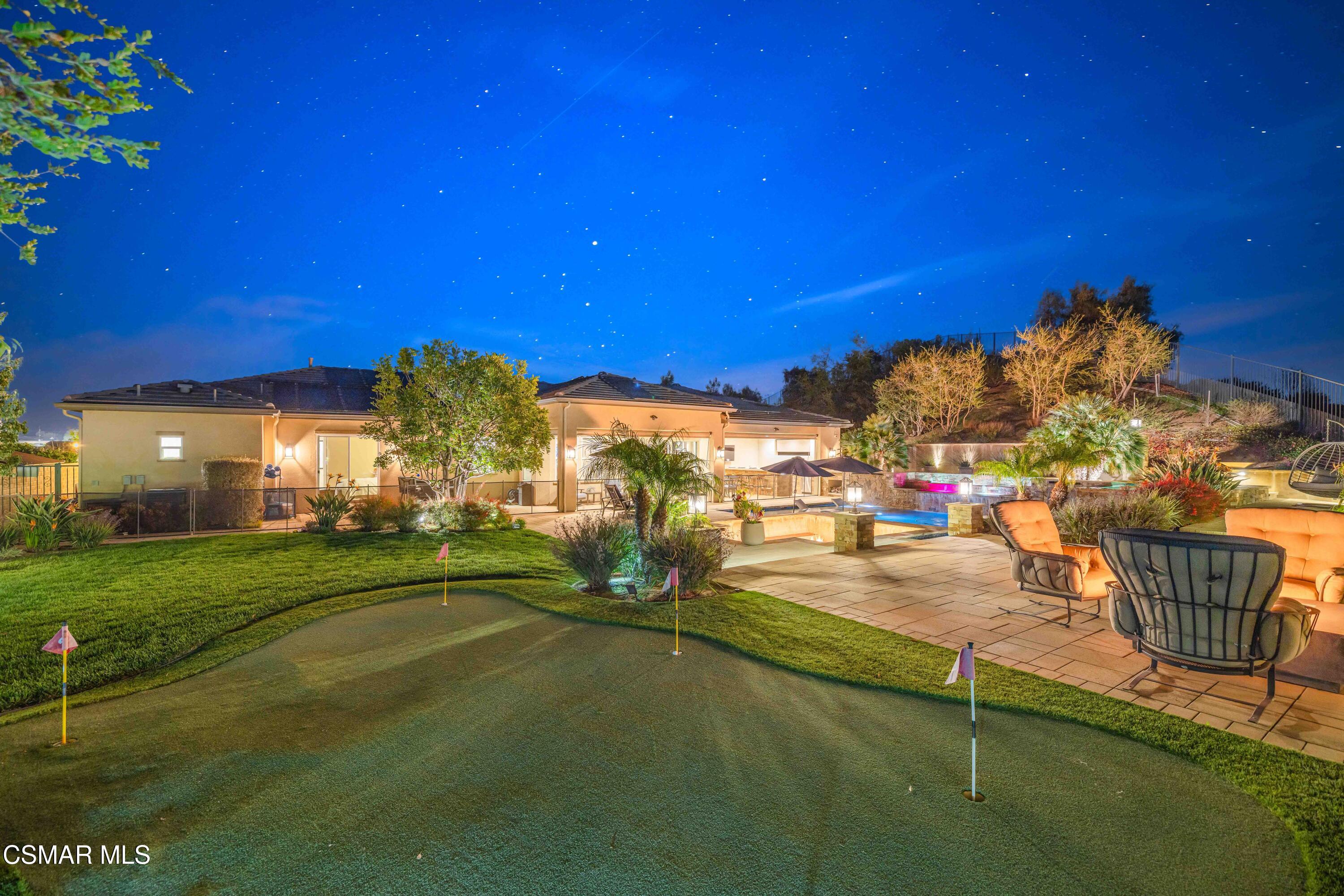 6508 High Country Place Moorpark, CA 93021 - Photo 58 of 95 a view of a fountain in front of a house with a yard