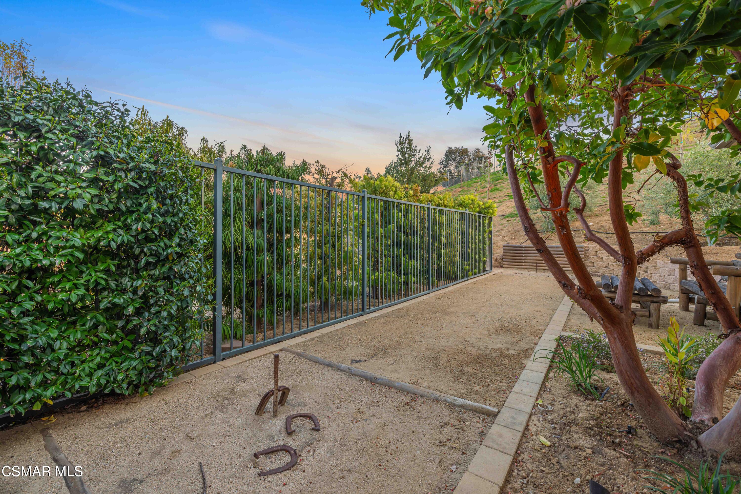6508 High Country Place Moorpark, CA 93021 - Photo 74 of 95 a view of a street with a tree in the background