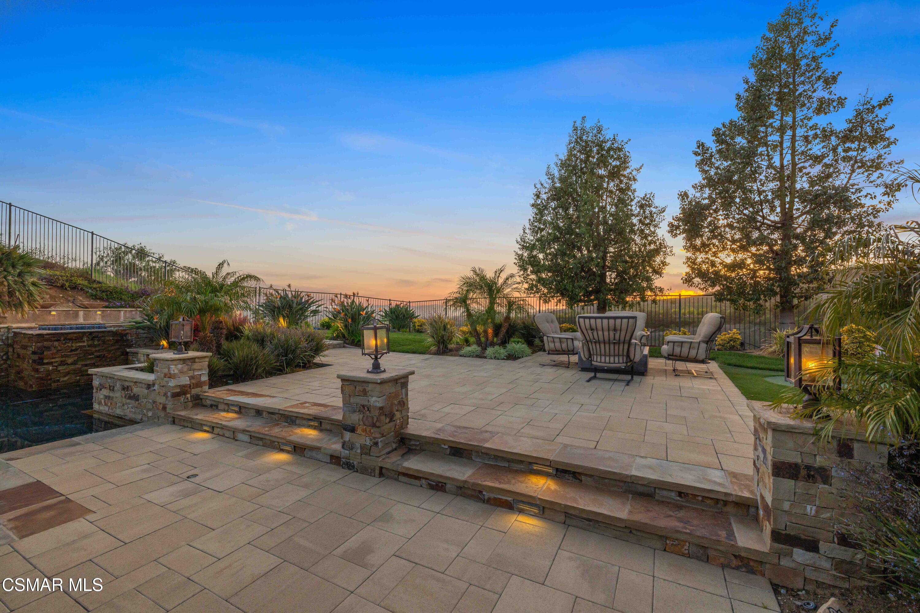 6508 High Country Place Moorpark, CA 93021 - Photo 77 of 95 a view of a patio with table and chairs a barbeque and potted plants
