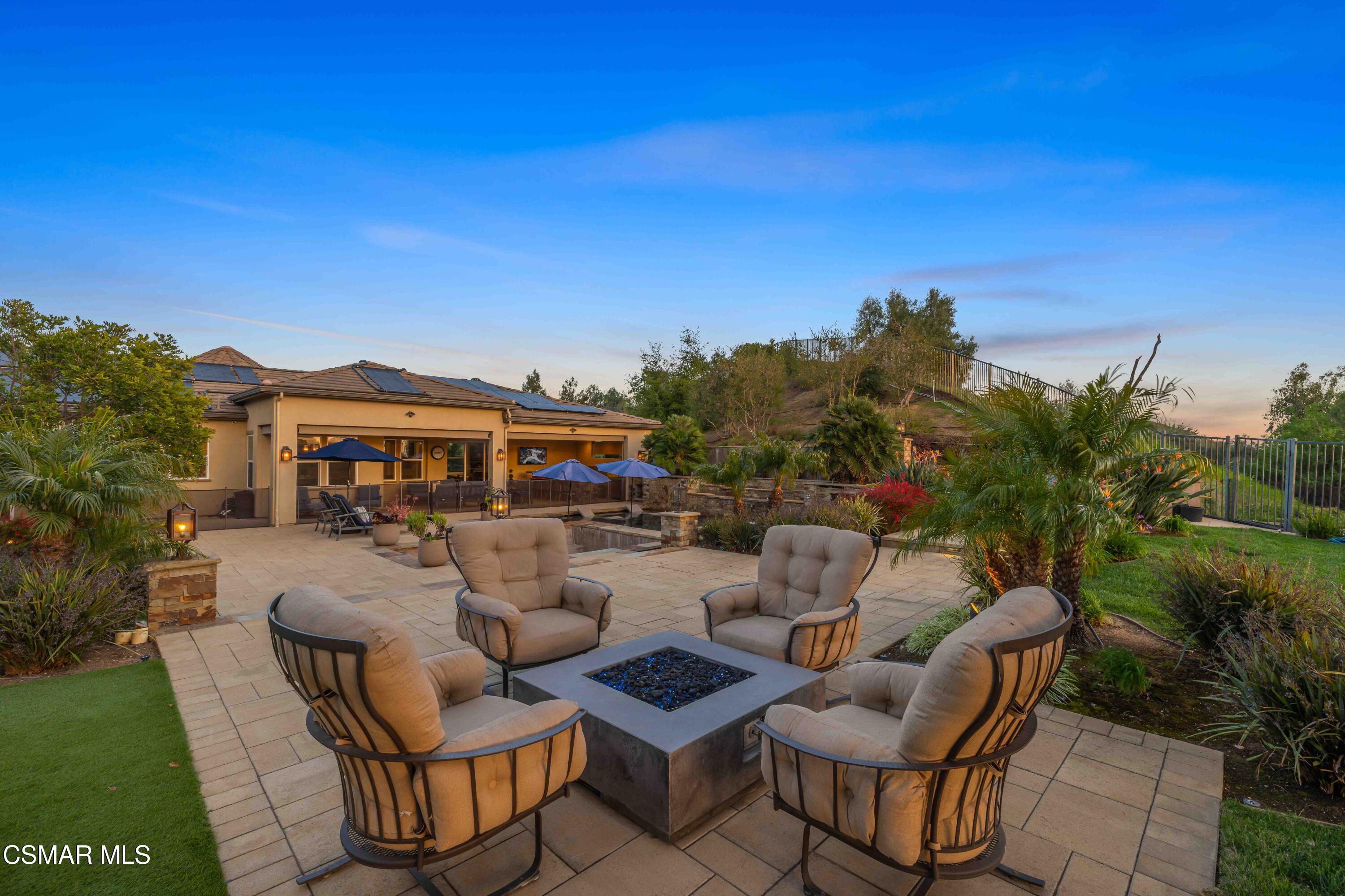 6508 High Country Place Moorpark, CA 93021 - Photo 79 of 95 a view of a patio with couches table and chairs with potted plants and mountain view
