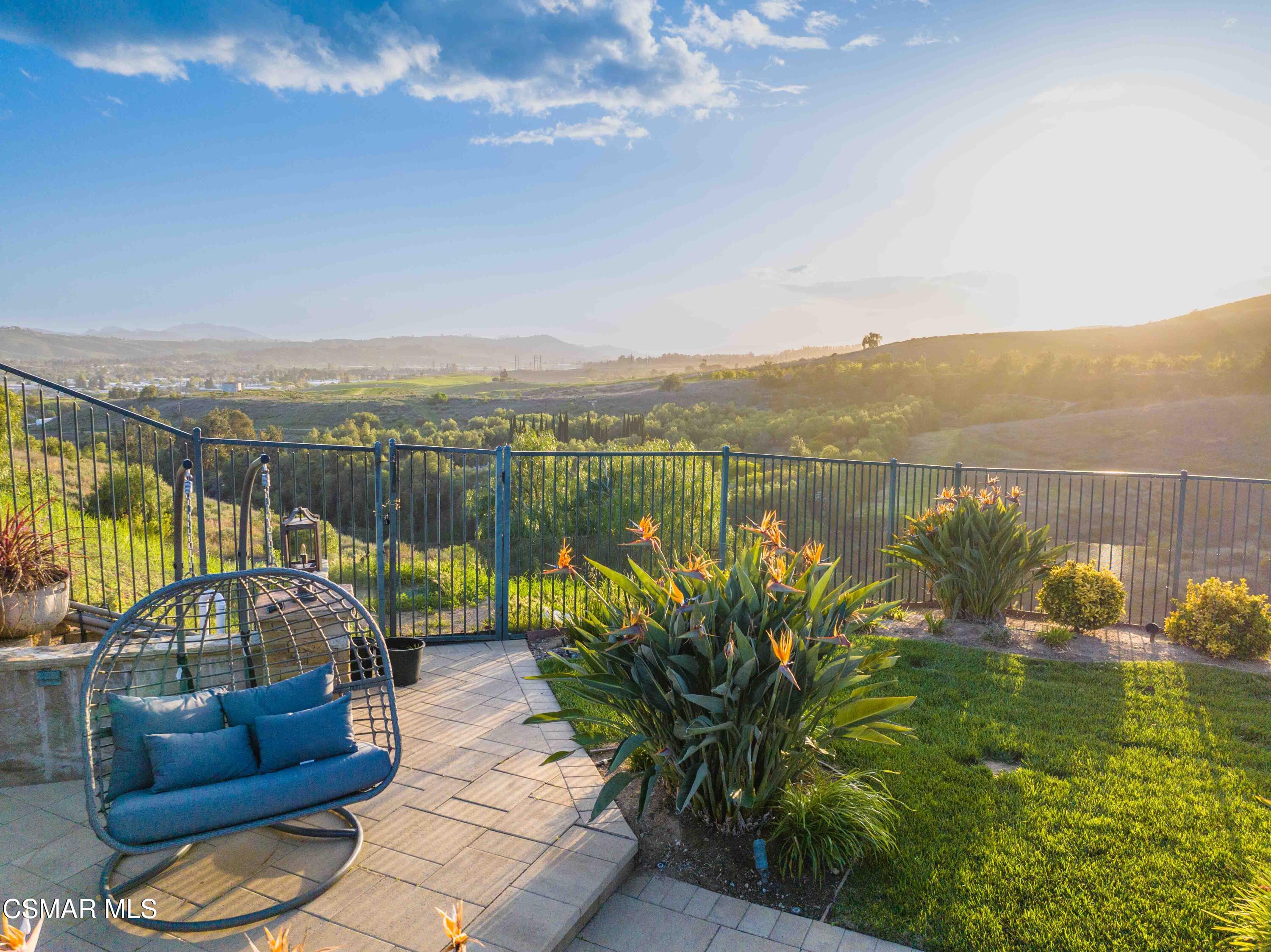 6508 High Country Place Moorpark, CA 93021 - Photo 80 of 95 a view of a lake with couches in the patio