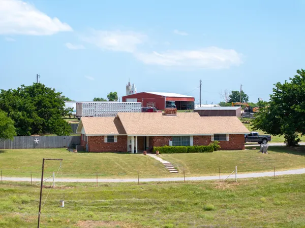 a aerial view of a house with a swimming pool