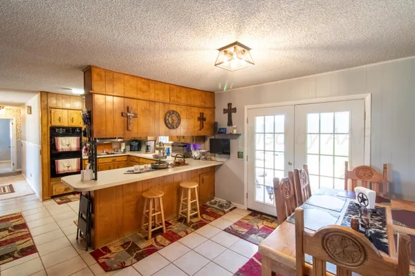 a very nice looking dining room with a large window