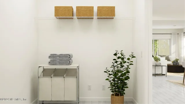 a view of a living room with a table and chairs