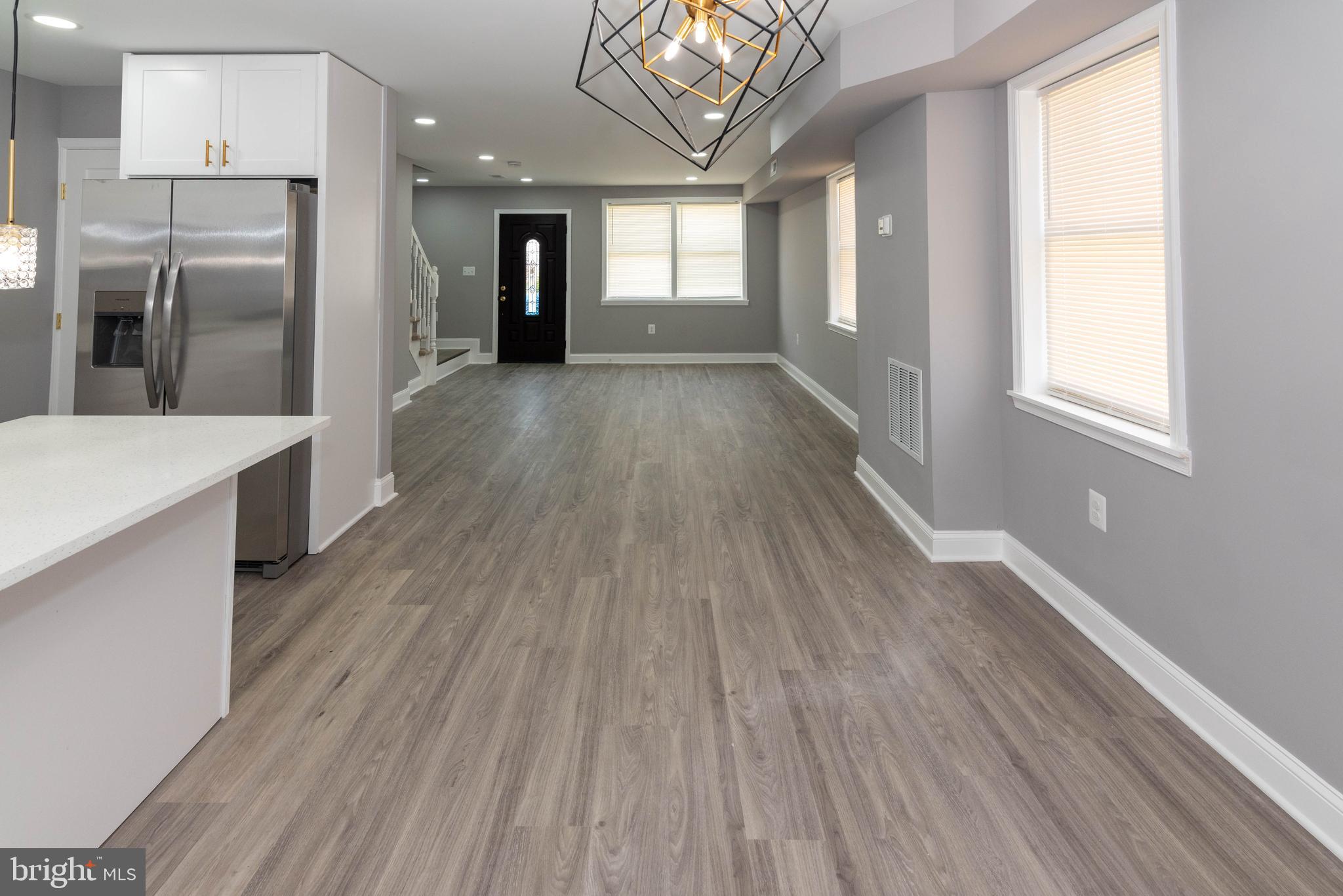 4843 Greencrest Road Baltimore, MD 21206 - Photo 9 of 44 a view of a kitchen with a fridge and wooden floor
