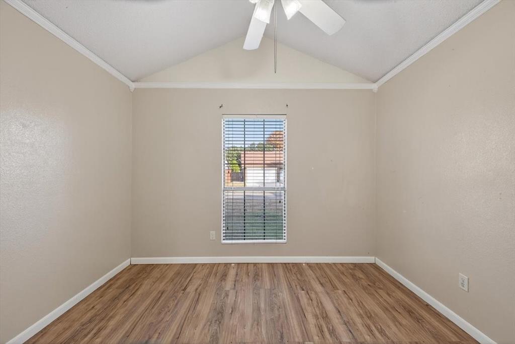 920 Danforth Place Arlington, TX 76017 - Photo 12 of 28 wooden floor in an empty room with a window