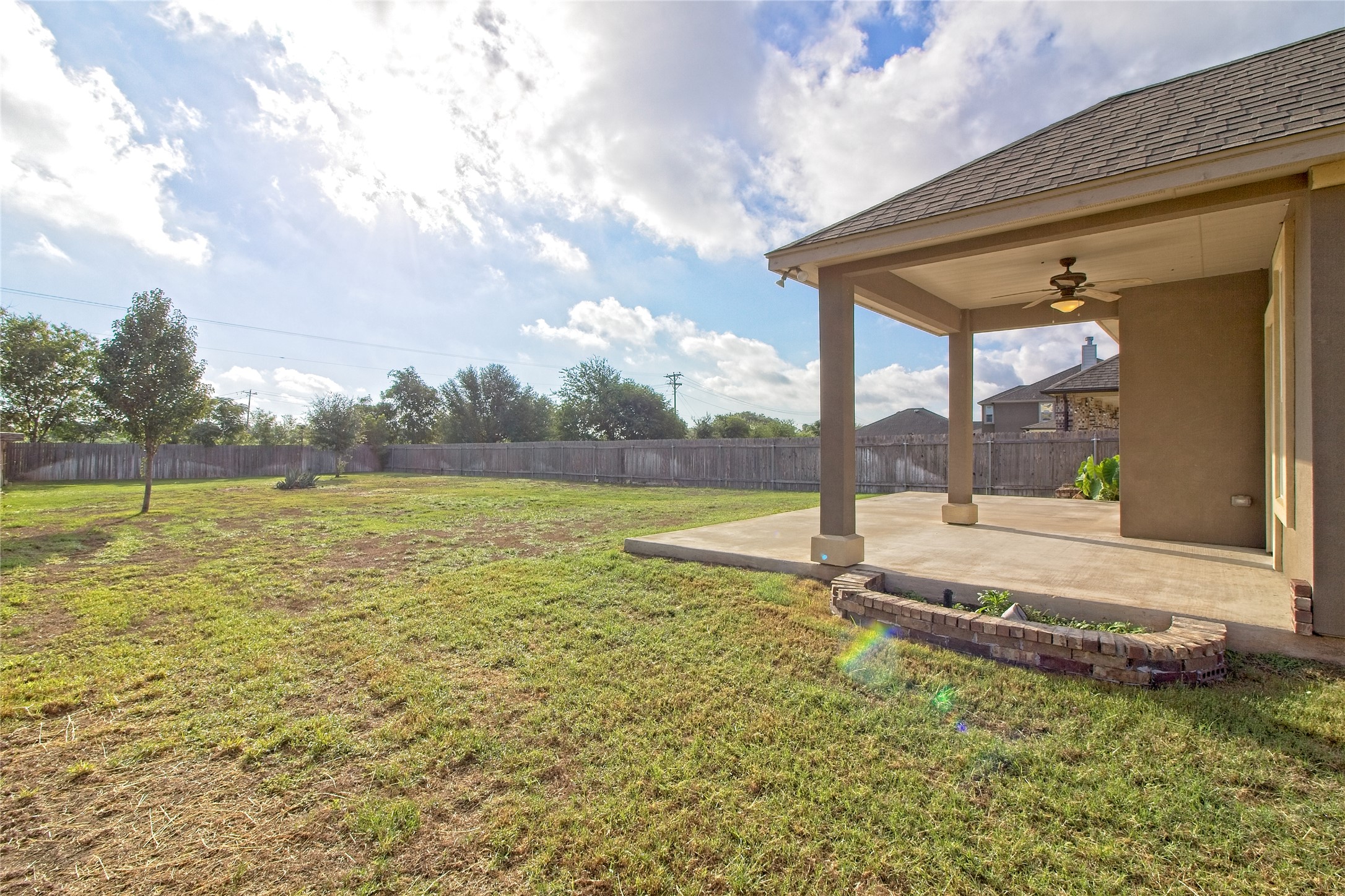 31443 Kingsway Road Georgetown, TX 78628 - Photo 27 of 40 A spacious backyard with a private covered patio, ideal for outdoor leisure.