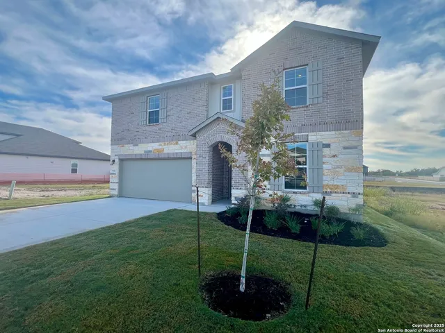 a house view with a garden space