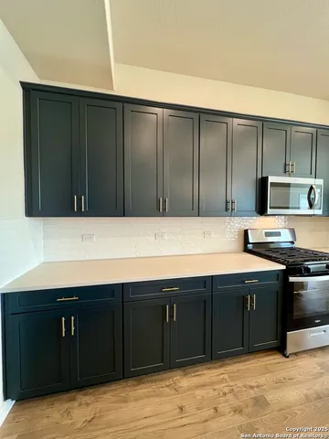 a view of staircase with white walls and railing