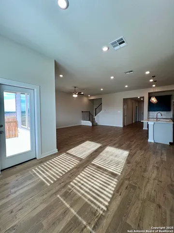 a bathroom with a double vanity sink a toilet and a mirror