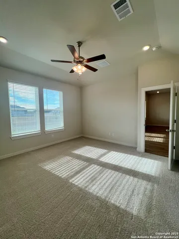 an empty room with a empty space and windows