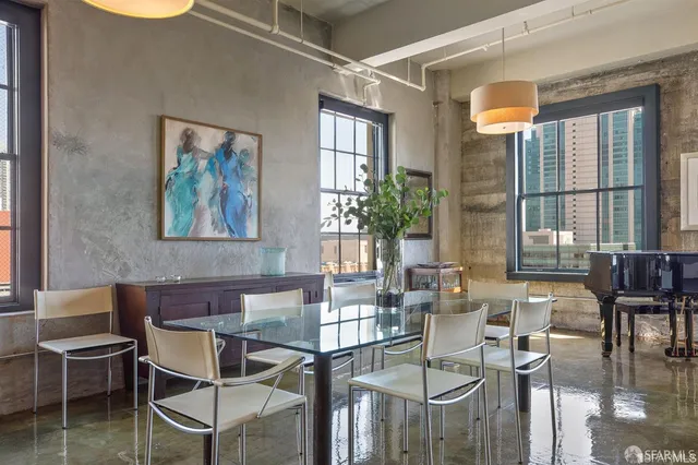 a dining room with furniture and window